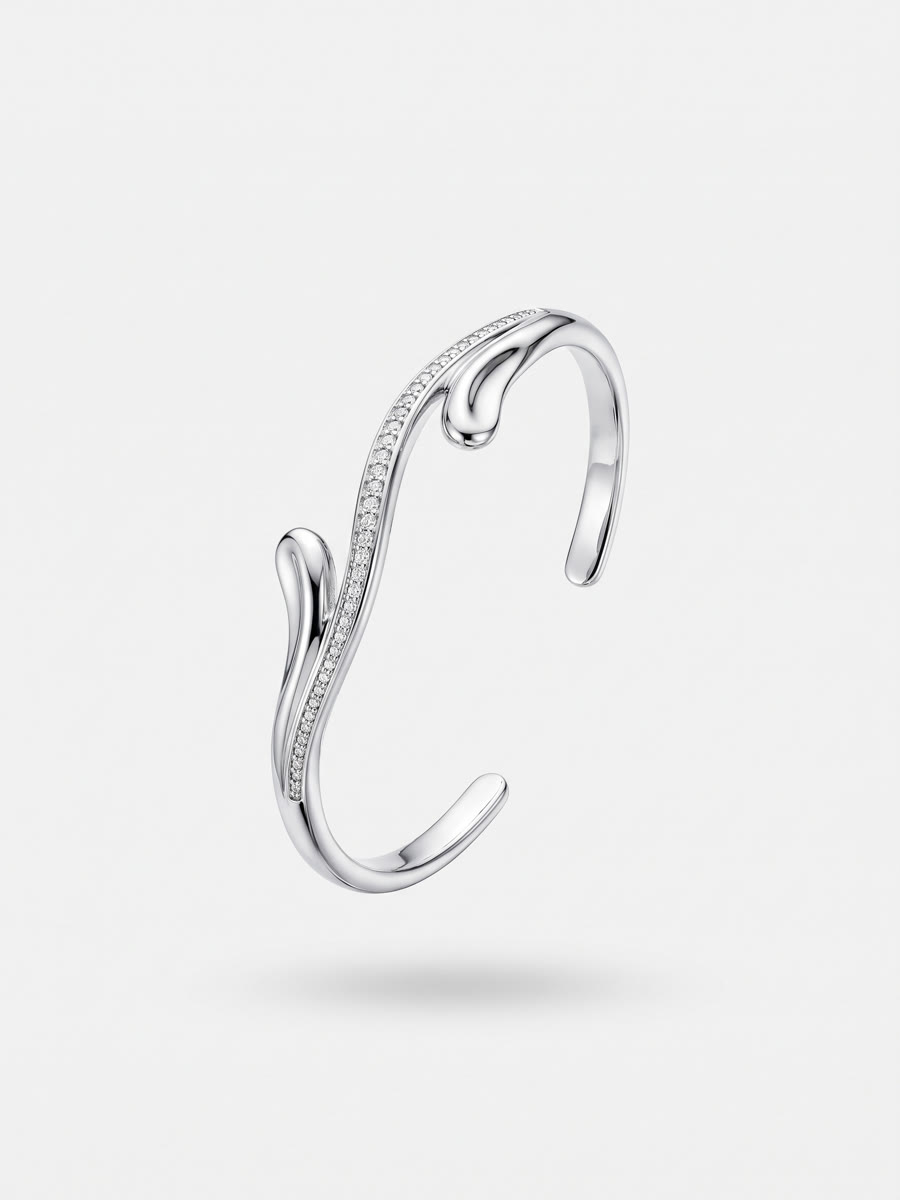 Sculptural silver open cuff with wave terminals