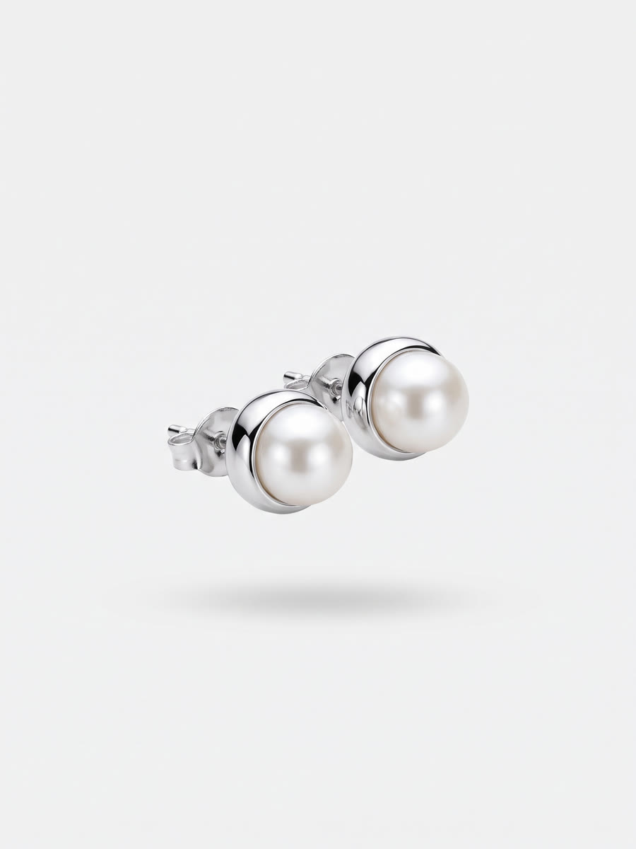 Silver stud earrings with white pearls