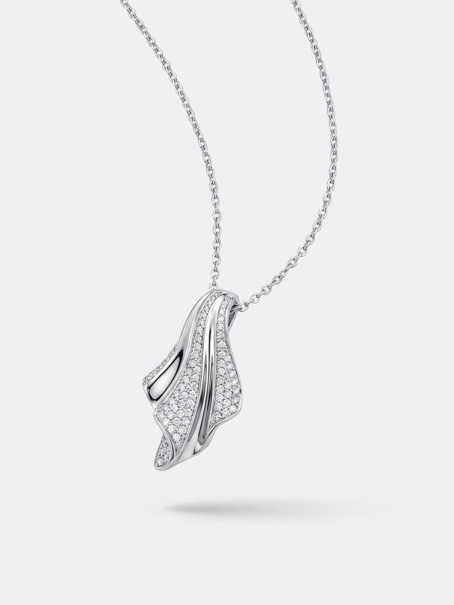 Silver necklace with a folded-wave pavé pendant