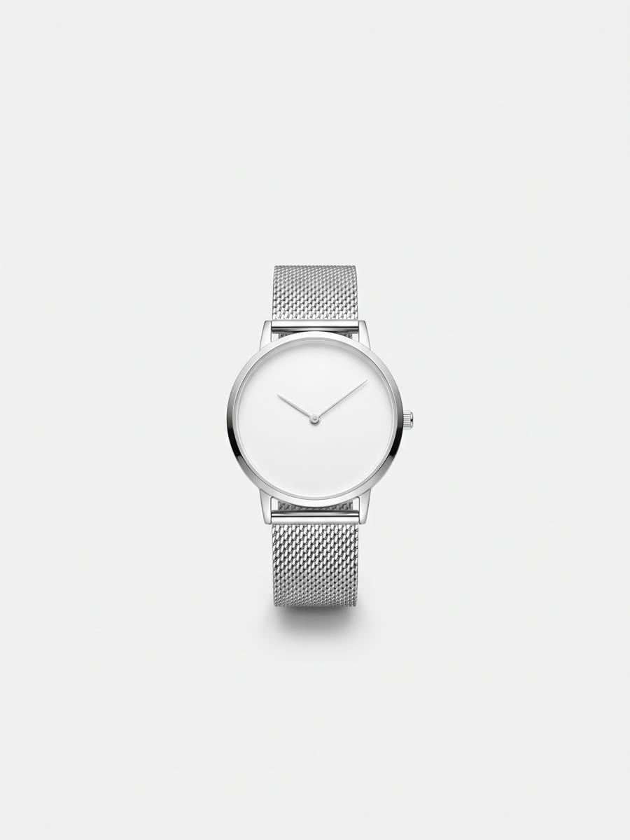Minimal silver watch on a mesh bracelet