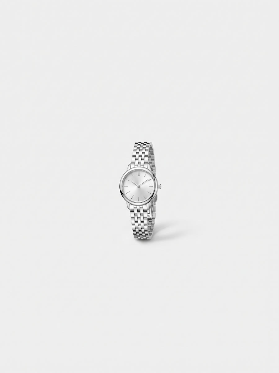 Small round silver watch on a link bracelet